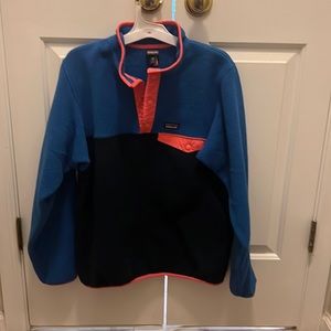 Patagonia Pullover, blue, black, and pink.